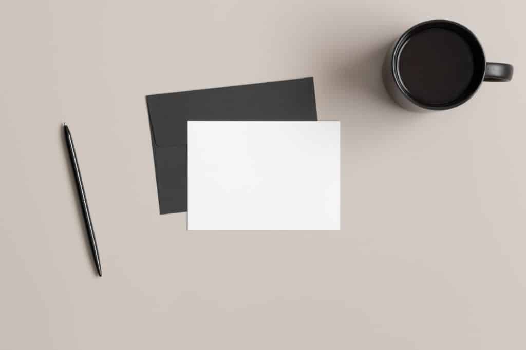 Invitation white card mockup with envelope, 5x7 ratio, similar to A6, A5. Workspace concept.